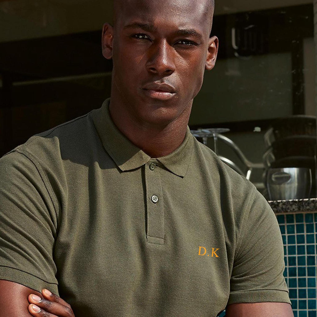 Men&#39;s Personalised initials Polo Shirt. Initials are printed on the left chest, small logo size in a classic serif font. The polo comes in a variety of print and colourways. Shirt Sleeve polo Shirt. 2 buttons on the placket. Pique fabic, 100% Cotton.