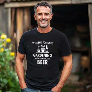 Man wearing a black t-shirt with gardening and beer text in a garden setting